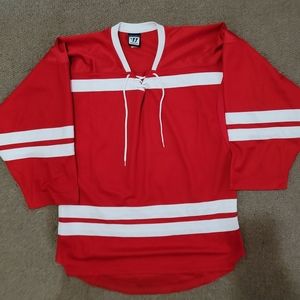 Red and white hockey jersey.